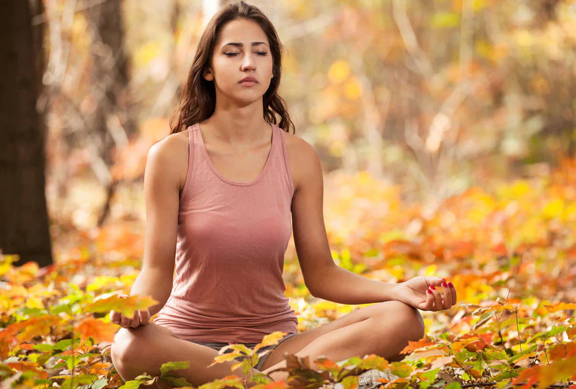A young lady doing breathing exercise